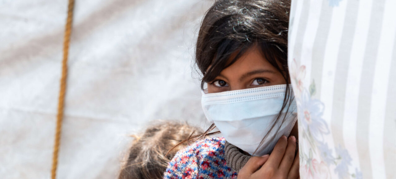 9 year old Bushra wearing a mask provided by Islamic Relief